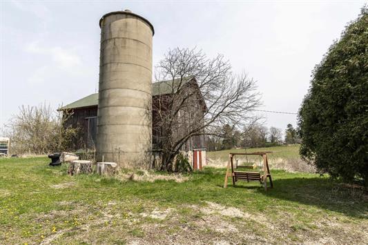 2608 County Road T, Sun Prairie, WI 53590 - view of yard featuring a barn and an outbuilding