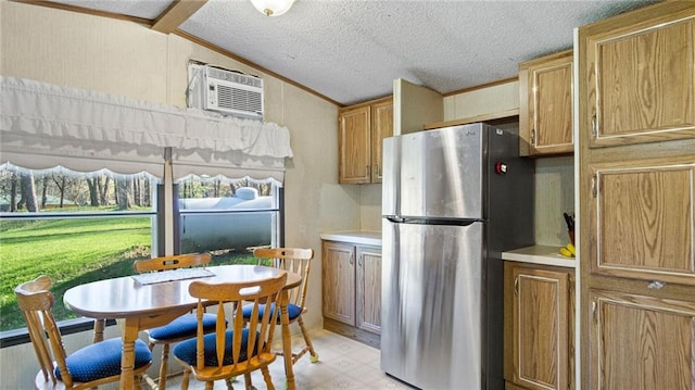 207 State Rd 25, Wheeler, WI 54772 - kitchen with freestanding refrigerator, lofted ceiling, a wall mounted AC, a textured ceiling, and light floors
