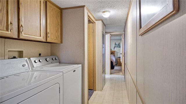 207 State Rd 25, Wheeler, WI 54772 - washroom with light floors, independent washer and dryer, a textured ceiling, and cabinet space