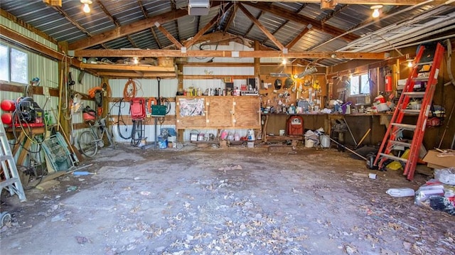 207 State Rd 25, Wheeler, WI 54772 - garage featuring a workshop area