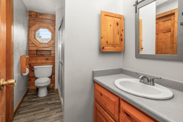 11934 187th Ave, Bristol, WI 53104 - bathroom featuring toilet, wood finished floors, vanity, and baseboards