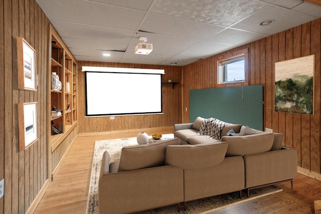 11934 187th Ave, Bristol, WI 53104 - cinema room with wooden walls, light wood-style floors, a drop ceiling, and baseboards