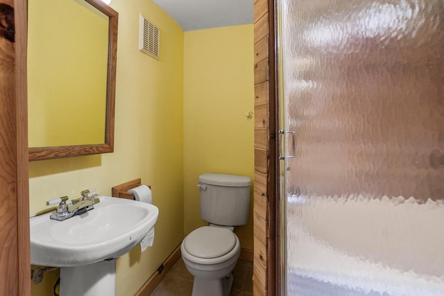 11934 187th Ave, Bristol, WI 53104 - bathroom with toilet, tile patterned floors, and a sink