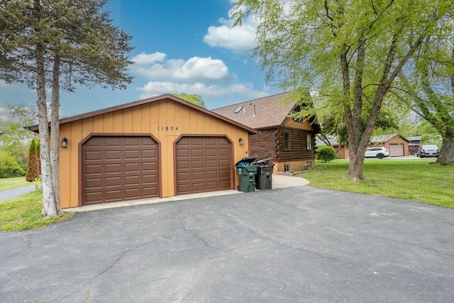 11934 187th Ave, Bristol, WI 53104 - view of front of property with a front lawn, log siding, a garage, and roof with shingles