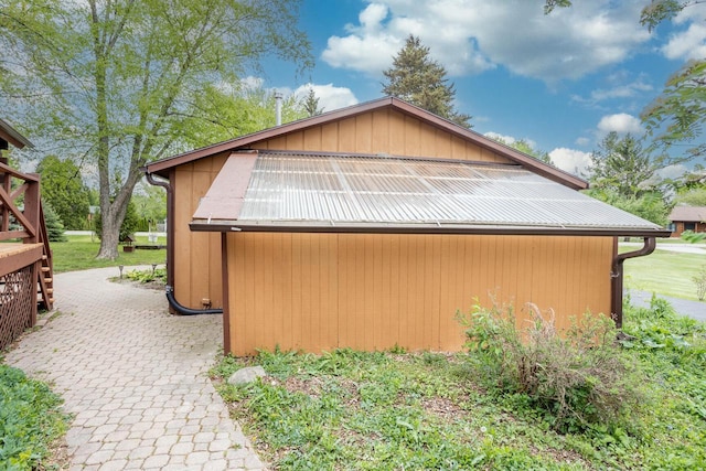 11934 187th Ave, Bristol, WI 53104 - view of home's exterior with metal roof, an outdoor structure, and an outbuilding