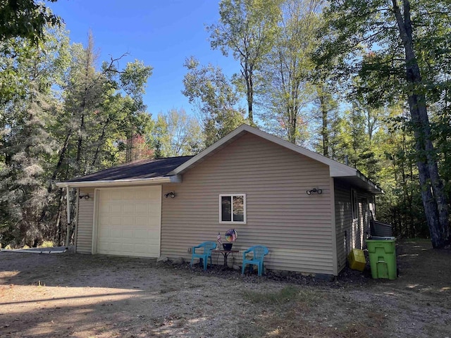 W9001 US Highway 8, Pembine, WI 54156 - view of home's exterior with a detached garage