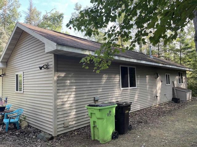 W9001 US Highway 8, Pembine, WI 54156 - view of side of home with roof with shingles