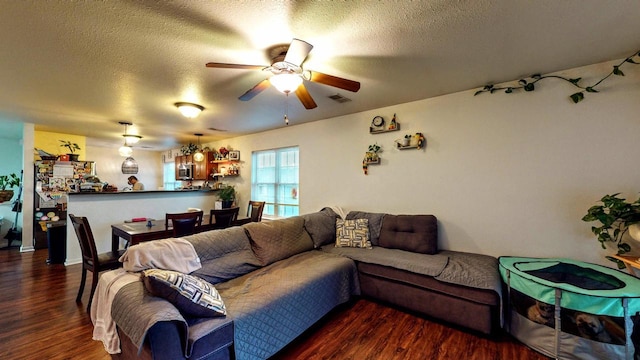 619 Reena Ave Unit 8, Fort Atkinson, WI 53538 - living area with ceiling fan, wood finished floors, and a textured ceiling