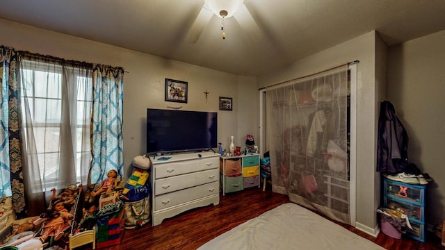 619 Reena Ave Unit 8, Fort Atkinson, WI 53538 - bedroom featuring dark wood-type flooring, a closet, and a ceiling fan