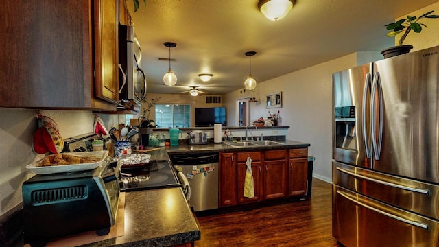 619 Reena Ave Unit 8, Fort Atkinson, WI 53538 - kitchen featuring appliances with stainless steel finishes, a sink, a ceiling fan, and dark countertops