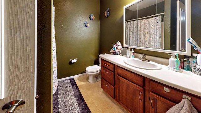 619 Reena Ave Unit 8, Fort Atkinson, WI 53538 - bathroom with tile patterned floors, vanity, baseboards, toilet, and a shower with curtain