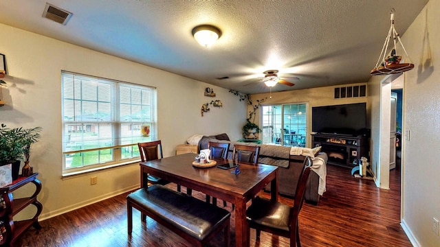 619 Reena Ave Unit 8, Fort Atkinson, WI 53538 - dining space with a textured ceiling, wood finished floors, ceiling fan, and baseboards