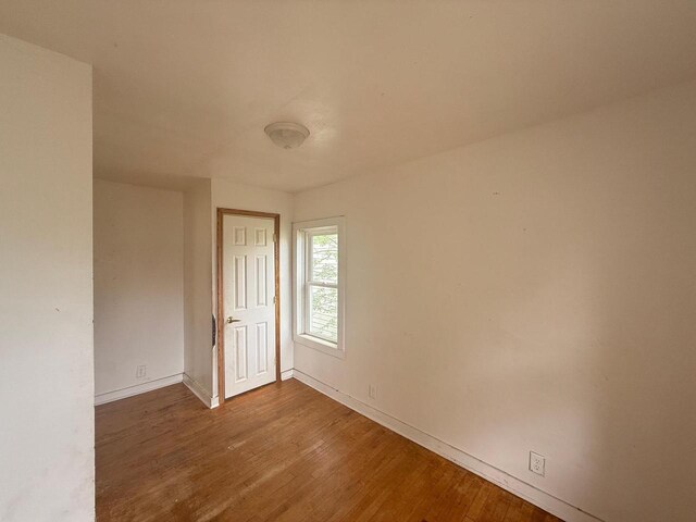 312 W 4th St, Marshfield, WI 54449 - spare room with wood finished floors and baseboards