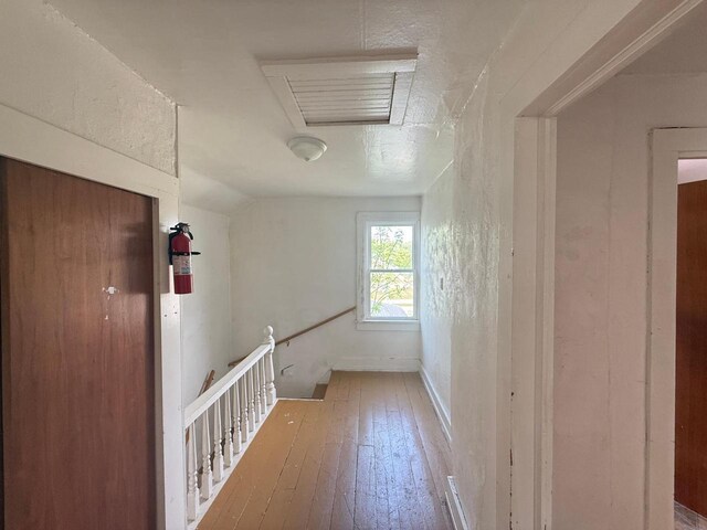 312 W 4th St, Marshfield, WI 54449 - hall featuring hardwood / wood-style floors and attic access