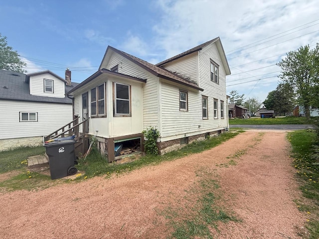 312 W 4th St, Marshfield, WI 54449 - view of home's exterior featuring dirt driveway