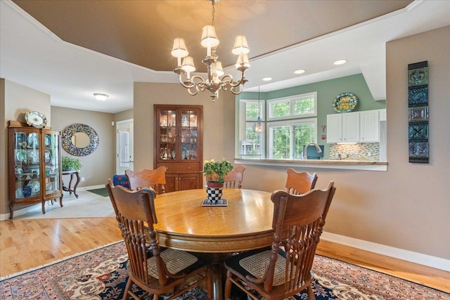 1814 Masters Ln, Madison, WI 53719 - dining area with baseboards, light wood-style floors, a chandelier, and recessed lighting