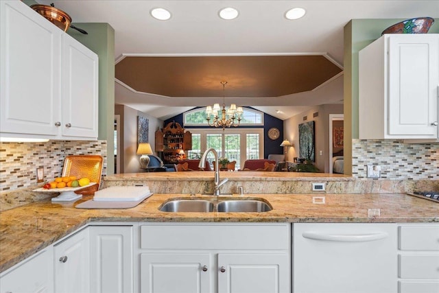1814 Masters Ln, Madison, WI 53719 - kitchen with a sink, dishwasher, open floor plan, a chandelier, and light stone counters