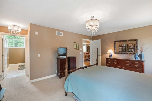 1814 Masters Ln, Madison, WI 53719 - bedroom featuring a chandelier, light carpet, and baseboards