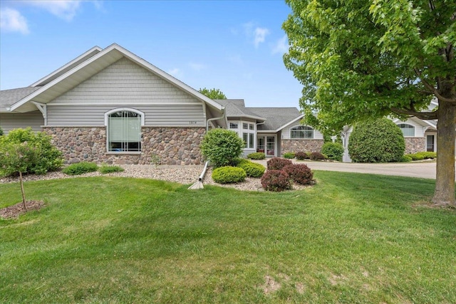 1814 Masters Ln, Madison, WI 53719 - view of front of property featuring stone siding and a front lawn
