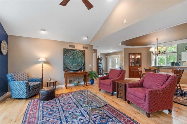 1814 Masters Ln, Madison, WI 53719 - living area featuring plenty of natural light, light wood-type flooring, a chandelier, ceiling fan, and lofted ceiling