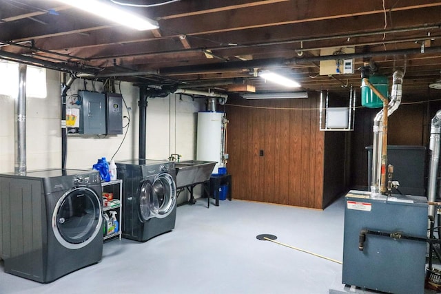 1007 Franklin St, Sauk City, WI 53583 - basement with washing machine and dryer, water heater, electric panel, and a sink