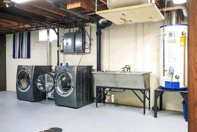 1007 Franklin St, Sauk City, WI 53583 - laundry area featuring water heater, independent washer and dryer, electric panel, and concrete block wall