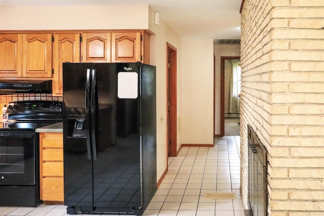 1007 Franklin St, Sauk City, WI 53583 - kitchen with black appliances, range hood, light tile patterned flooring, a baseboard radiator, and decorative backsplash