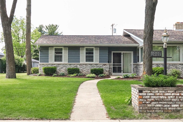 1007 Franklin St, Sauk City, WI 53583 - view of front of home featuring a front lawn and a chimney