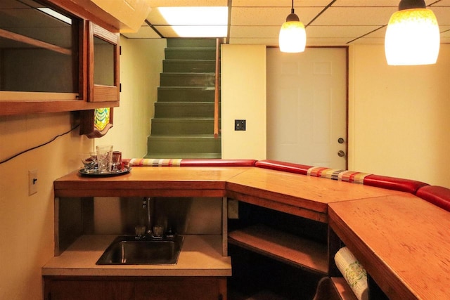 1007 Franklin St, Sauk City, WI 53583 - bar area with decorative light fixtures, a drop ceiling, and stairs