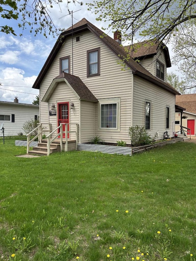 307 E Washington St, Crandon, WI 54520 - rear view of property with a yard, a chimney, and a shingled roof