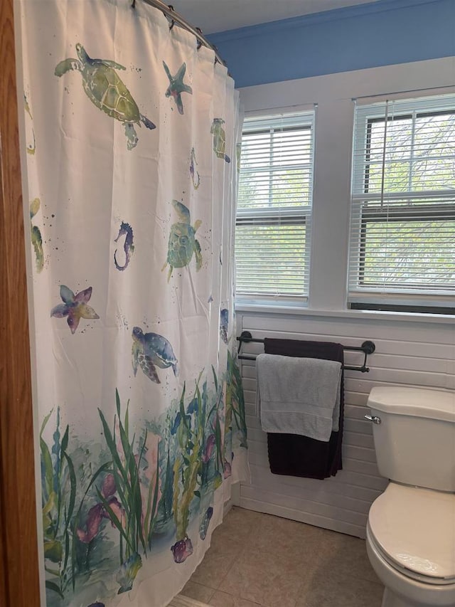 307 E Washington St, Crandon, WI 54520 - bathroom featuring tile patterned flooring, toilet, and a shower with curtain