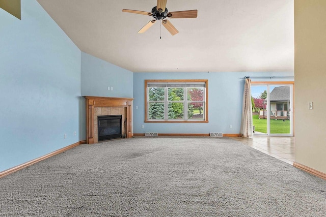 1126 Princess Dove Cir, De Pere, WI 54115 - unfurnished living room featuring plenty of natural light, carpet floors, vaulted ceiling, a ceiling fan, and baseboards