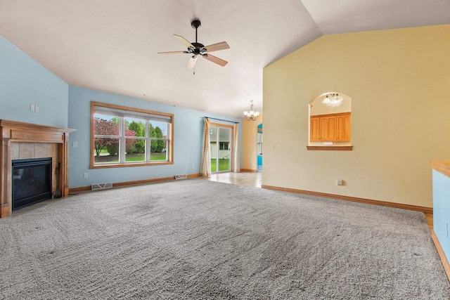 1126 Princess Dove Cir, De Pere, WI 54115 - unfurnished living room featuring lofted ceiling, ceiling fan, carpet floors, a chandelier, and a tiled fireplace