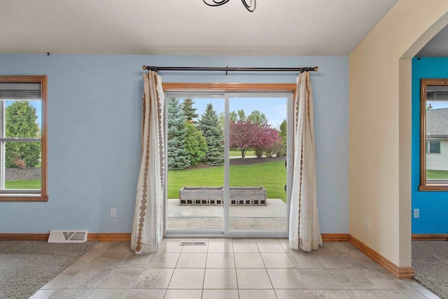 1126 Princess Dove Cir, De Pere, WI 54115 - doorway with baseboards, healthy amount of natural light, and arched walkways