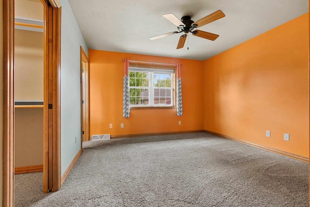 1126 Princess Dove Cir, De Pere, WI 54115 - unfurnished bedroom featuring carpet floors, baseboards, and ceiling fan