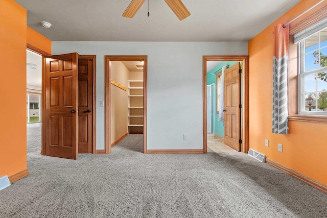1126 Princess Dove Cir, De Pere, WI 54115 - unfurnished bedroom featuring carpet, a walk in closet, baseboards, a closet, and connected bathroom