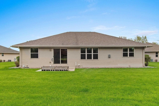 1126 Princess Dove Cir, De Pere, WI 54115 - rear view of house with a yard and a shingled roof