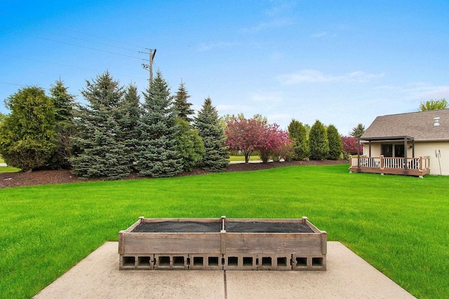 1126 Princess Dove Cir, De Pere, WI 54115 - view of green lawn with a vegetable garden and a wooden deck