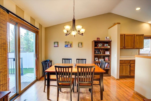182 Ames St, Oregon, WI 53575 - dining room with lofted ceiling, a chandelier, light wood finished floors, and recessed lighting