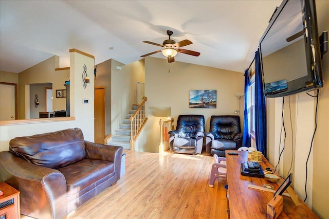 182 Ames St, Oregon, WI 53575 - living room with vaulted ceiling, a ceiling fan, wood finished floors, and stairs
