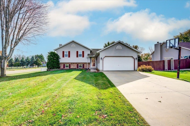 182 Ames St, Oregon, WI 53575 - split level home featuring a garage, driveway, and brick siding