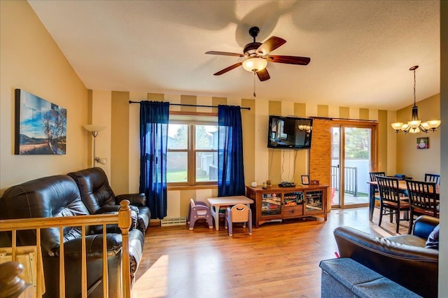 182 Ames St, Oregon, WI 53575 - living room featuring a chandelier, ceiling fan, wood finished floors, and healthy amount of natural light