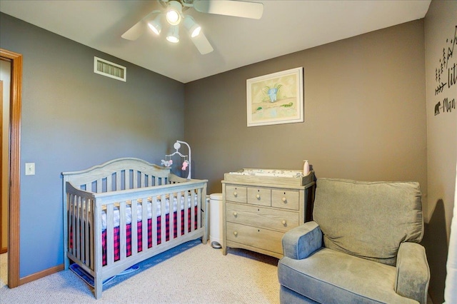 182 Ames St, Oregon, WI 53575 - carpeted bedroom with a ceiling fan, a nursery area, and baseboards