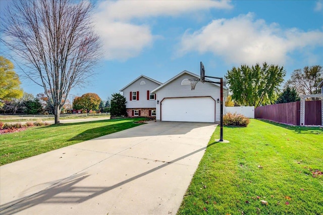 182 Ames St, Oregon, WI 53575 - view of front of home featuring concrete driveway, an attached garage, and brick siding