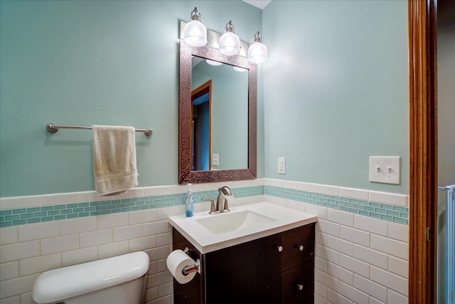 182 Ames St, Oregon, WI 53575 - bathroom with tile walls, a wainscoted wall, toilet, and vanity