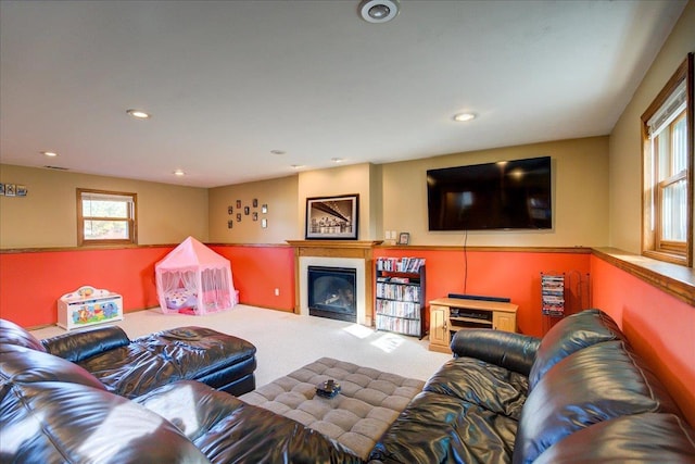 182 Ames St, Oregon, WI 53575 - living area with carpet flooring, a glass covered fireplace, and recessed lighting