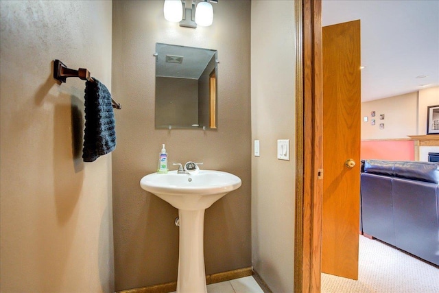 182 Ames St, Oregon, WI 53575 - bathroom featuring a sink and a fireplace