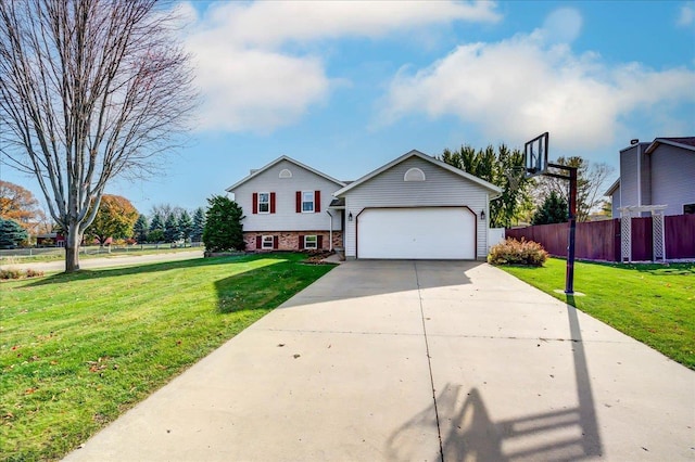 182 Ames St, Oregon, WI 53575 - view of front of home featuring brick siding, concrete driveway, and a garage