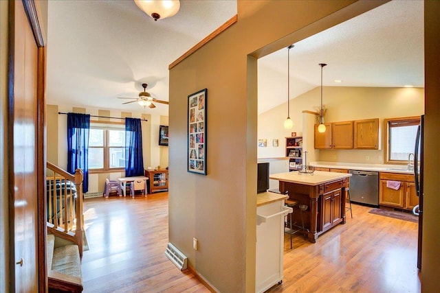182 Ames St, Oregon, WI 53575 - hall featuring light wood-style floors, lofted ceiling, a sink, baseboards, and stairs