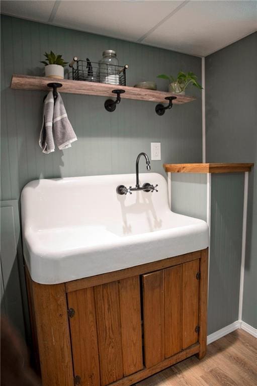 2702 Clark Pl, Eau Claire, WI 54701 - bathroom with wood finished floors, baseboards, and vanity